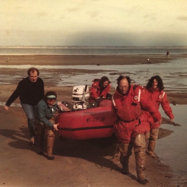 CCS researchers haul a Zodiac ashore
